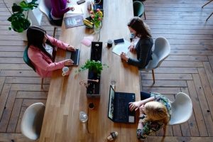 Women working in shared office space