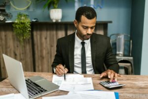 Man in suit managing business finances