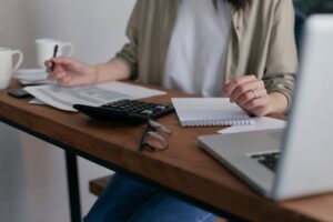 Business woman working at desk to achieve financial clarity