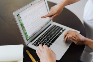 working on a laptop to Repurpose content