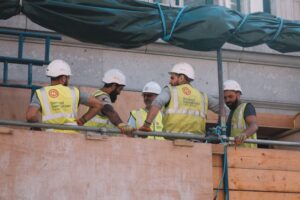 Construction workers working on a street for a construction business