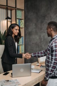 woman and man shaking hands about business expansion