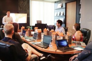 Man discussing policy changes at meeting