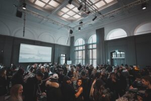 People inside a conference room -An example of visual communication the event space design