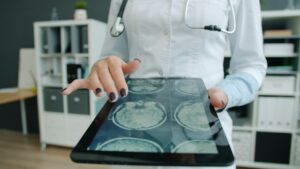Woman using ipad to improve efficiency in the healthcare business