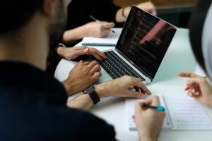 Group of colleagues meeting to improve business workflow